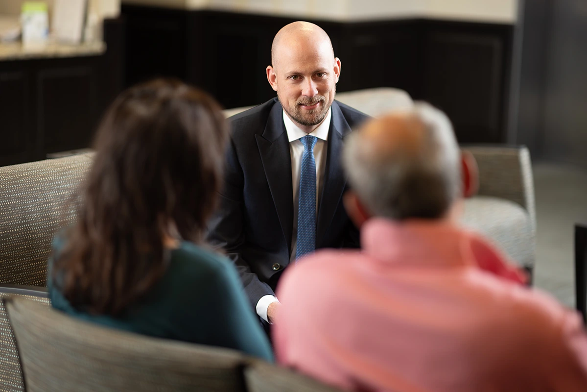 Dr. Gregory Frankel, neurosurgery specialist, consulting with a patient