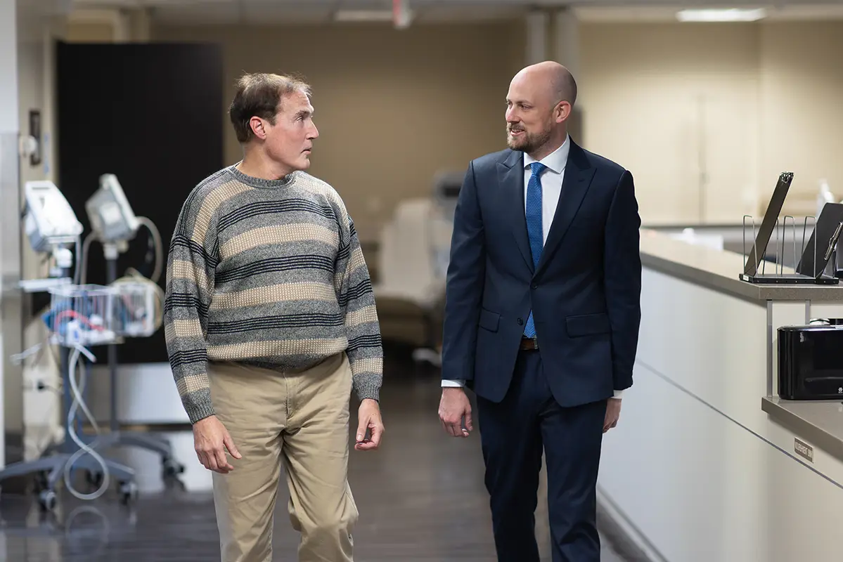 Dr. Gregory Frankel, neurosurgery specialist, consulting with a patient