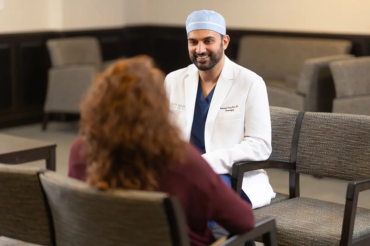 Dr. Mohammed Faraz Khan, spine specialist, consulting with a patient